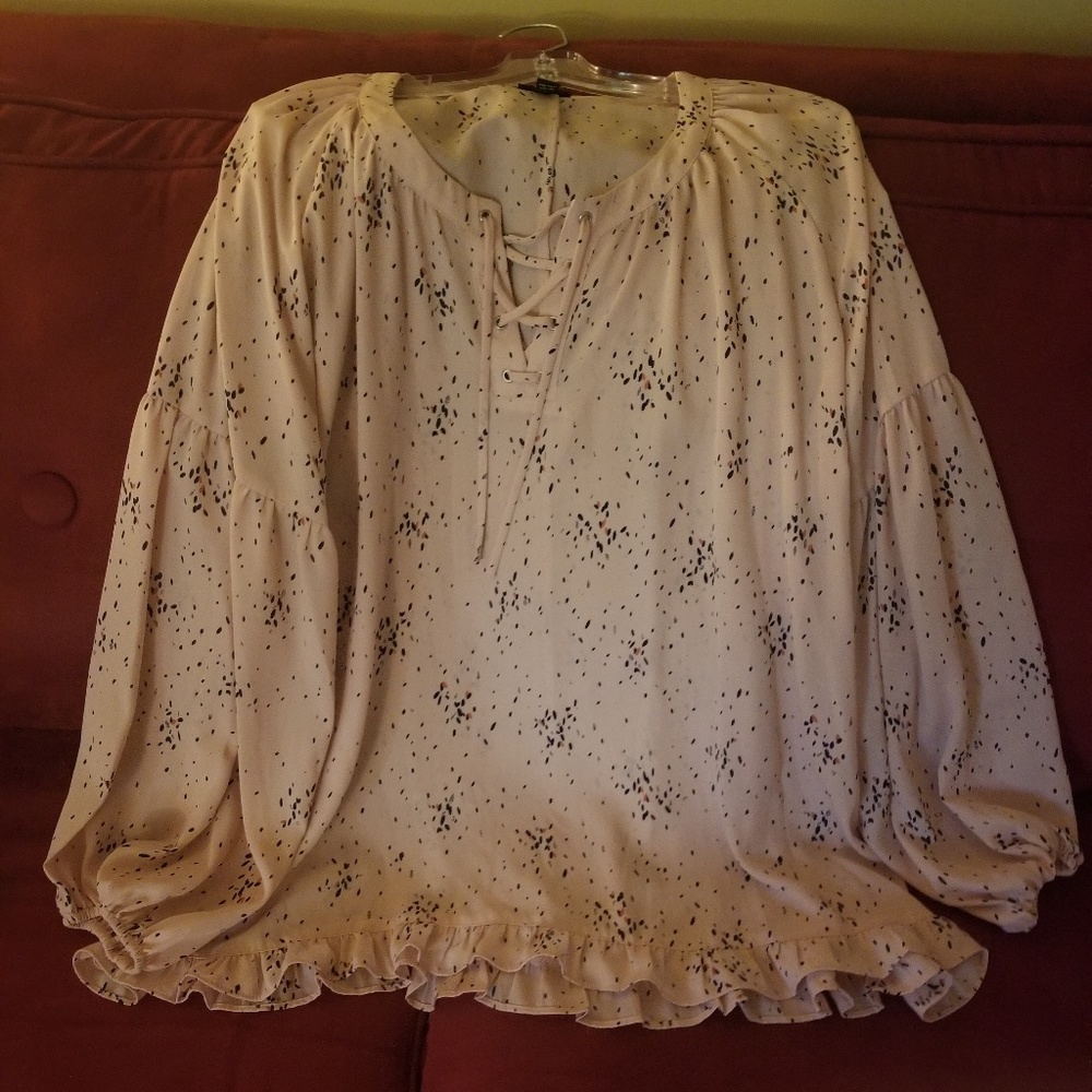 Woman front tie ruffle bottom blouse